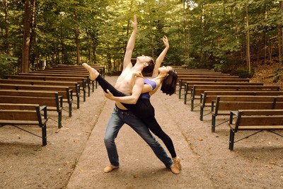 Bethany Latham and Alex Carrazzone dancing in the woods