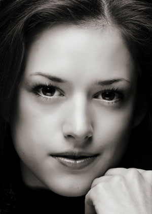 A close up shot of Anna Gerberich with her head resting on her hand