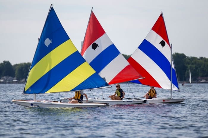 Three teens sailing on Chautauqua Lake