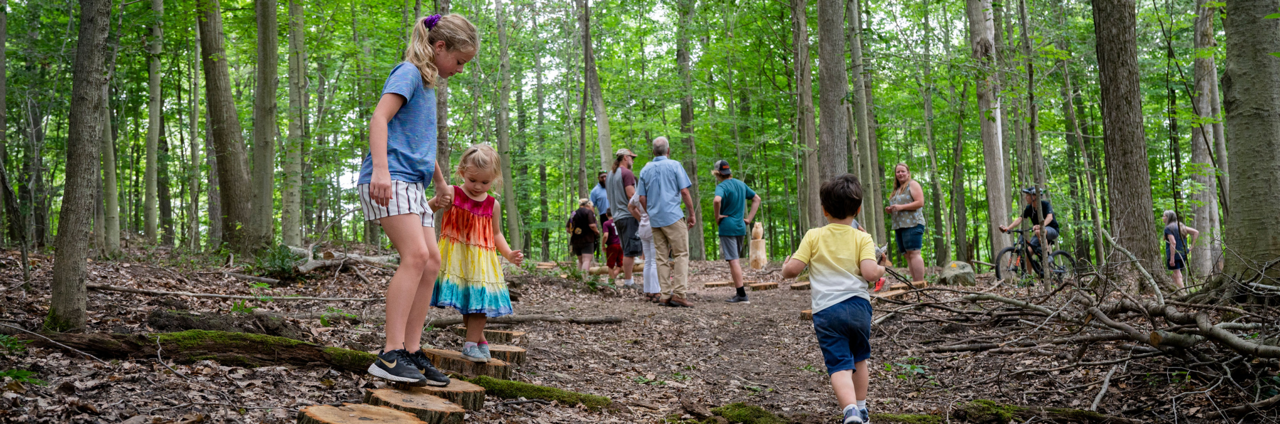 Children and adults exploring the new CHQ Trail