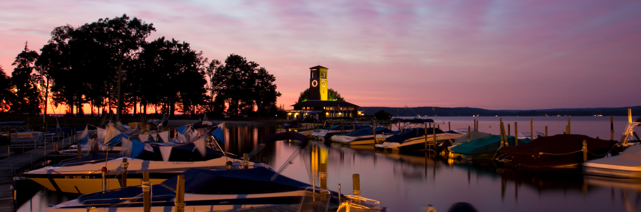 Miller Bell Tower and the docks at sunset on Chautauqua Lake