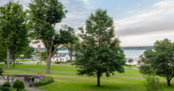 A view of Miller Bell Tower and Chautauqua Lake from the Athenaeum Hotel porch