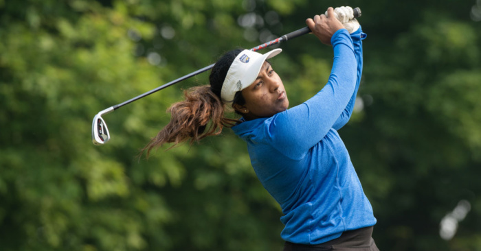 A woman golfing