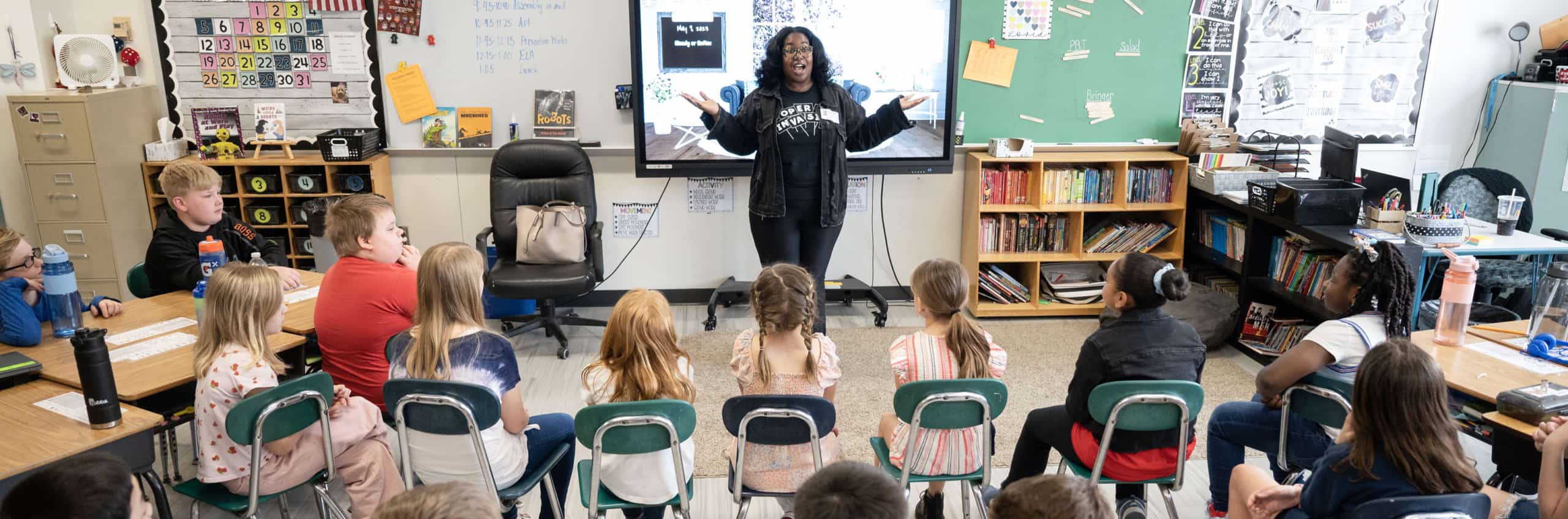 An opera singer engaging with a classroom of kids