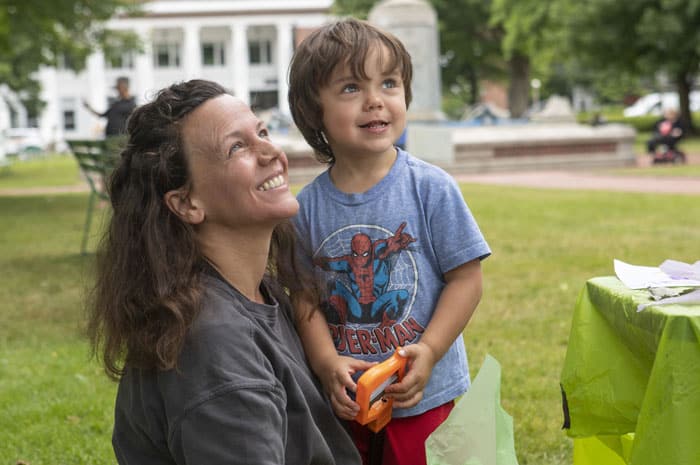 A mother and son smiling in Bestor Plaza