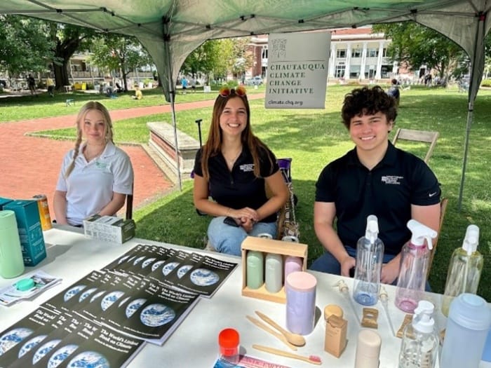 Interns sitting at the Climate Change Initiative table in Bestor Plaza