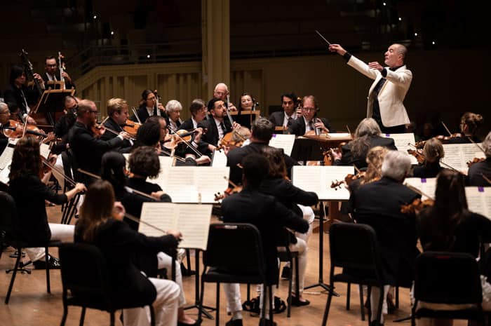 Rossen Milanov conducting the Chautauqua Symphony Orchestra in the Amphitheater.