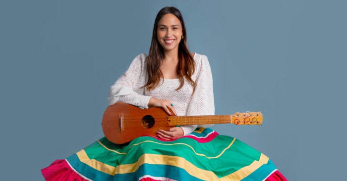 Sonia de los Santos holding a guitar