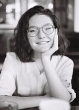 Karmen Grubisic resting her head on her hand