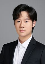 Runyang Wang in a black suit