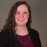 Courtney Wigdahl-Perry in a maroon shirt and black sweater