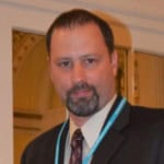 Rob Richardson in a black suit