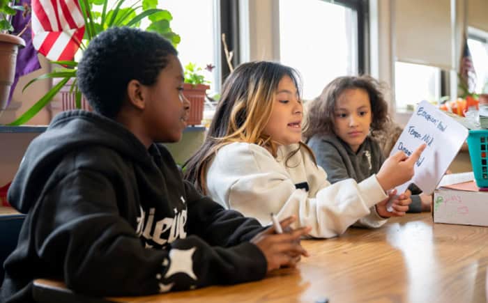 Students talking in a classroom