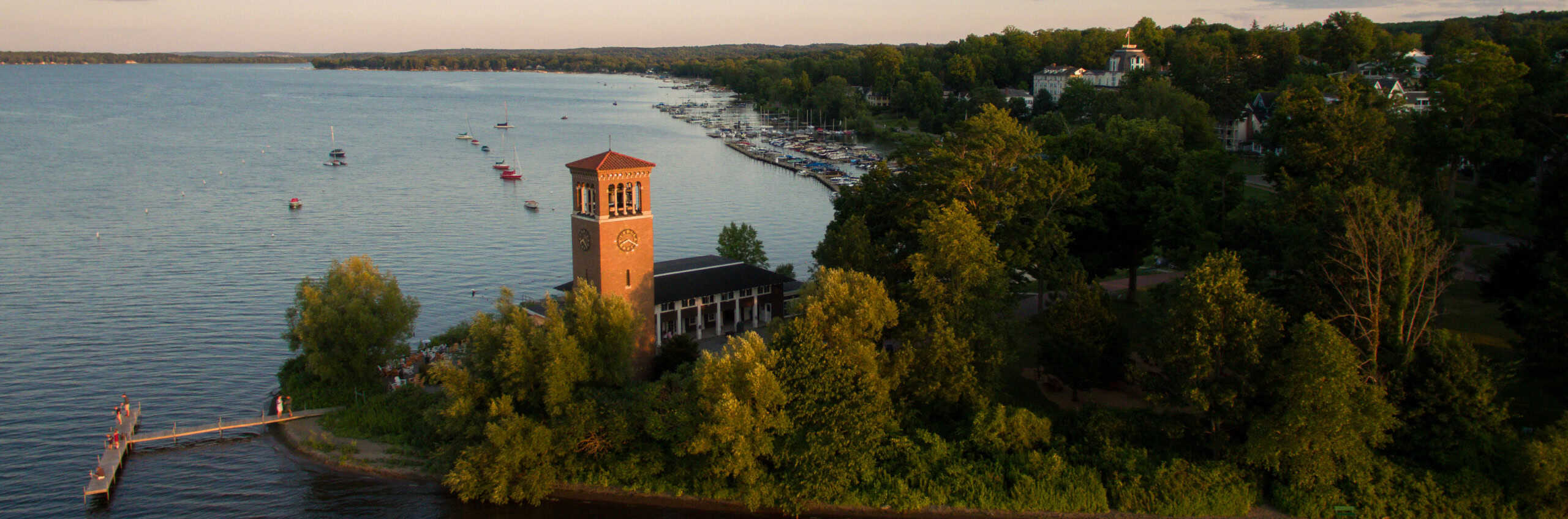 An aerial view of the Miller Bell Tower and lake shore