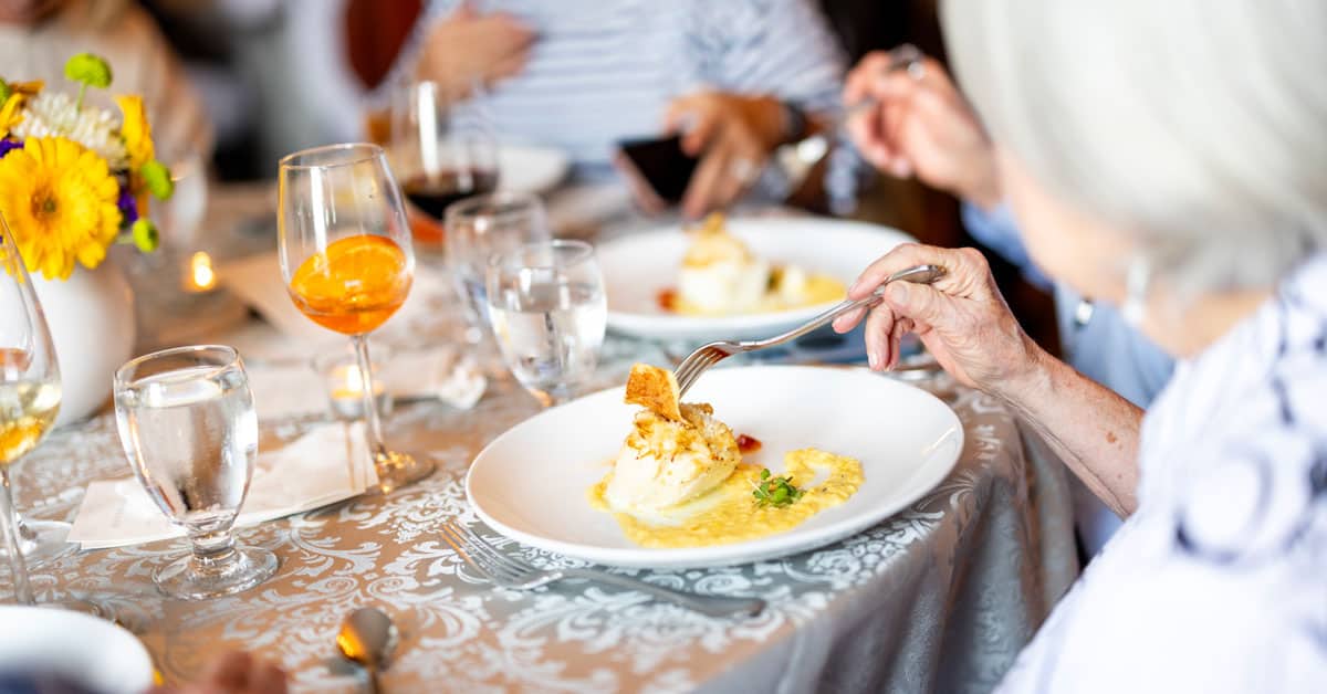 People eating dinner around a table