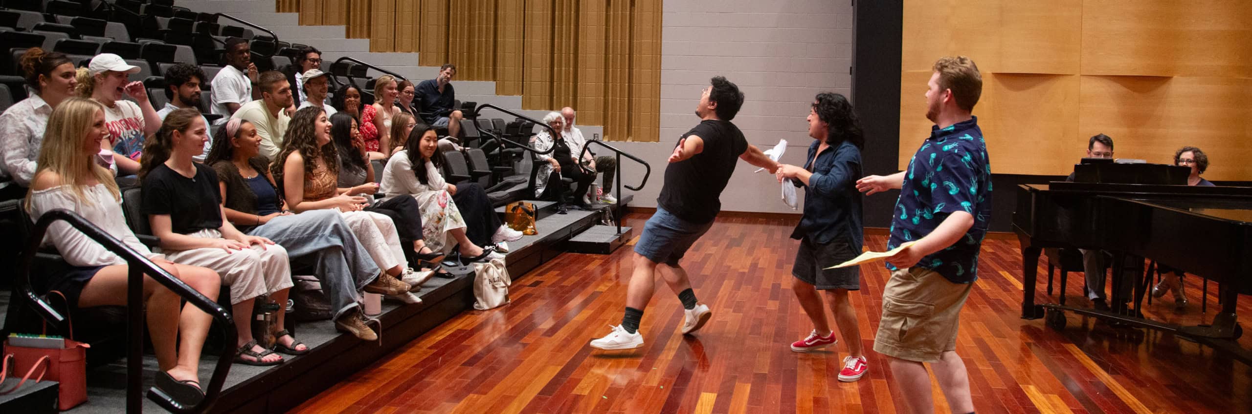 Opera Conservatory students sitting in the audience while someone sings