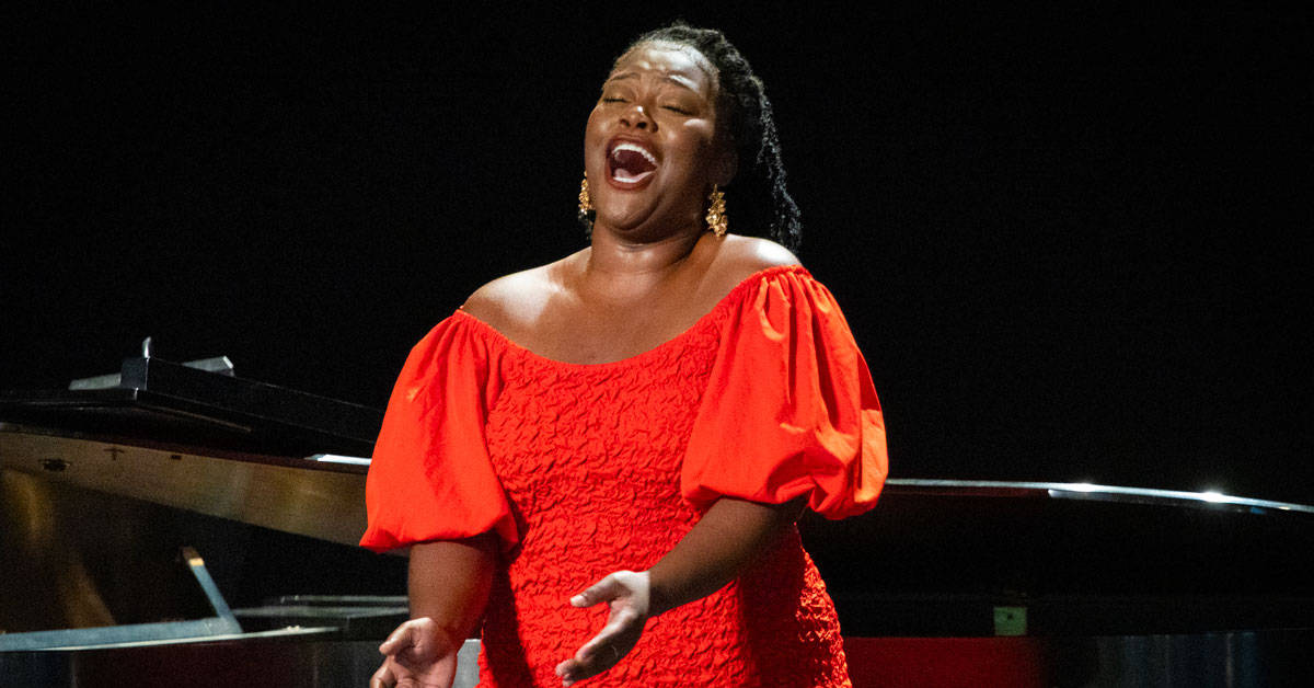 An opera singer in a red dress
