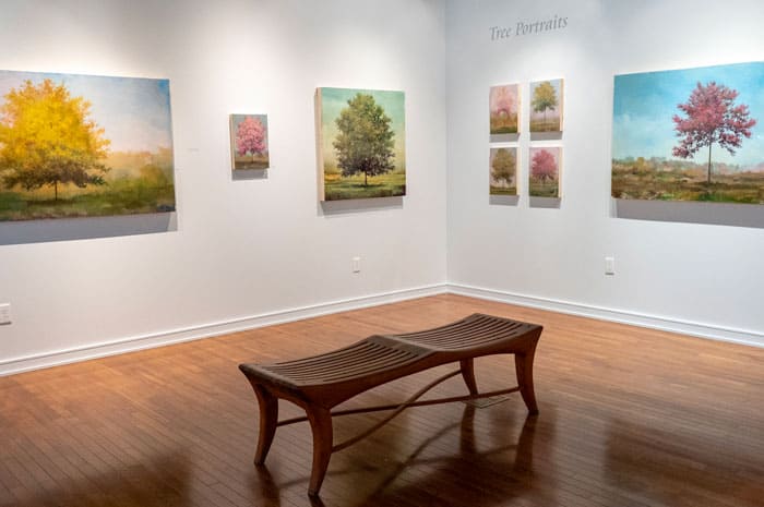 Paintings of trees in an art gallery