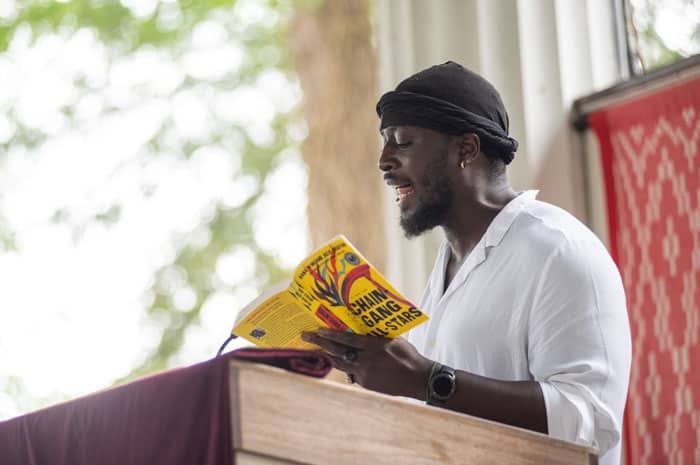 A man reading from a book