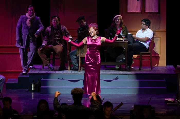 An opera singer in a pink dress