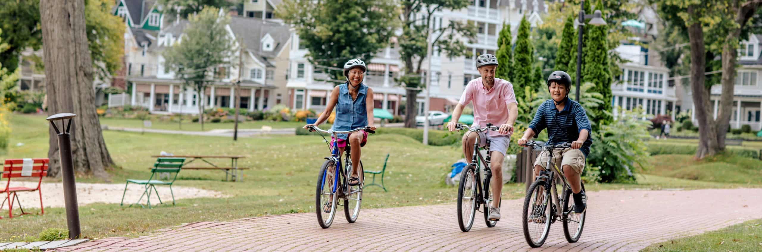 A family riding bikes on the brickwalk