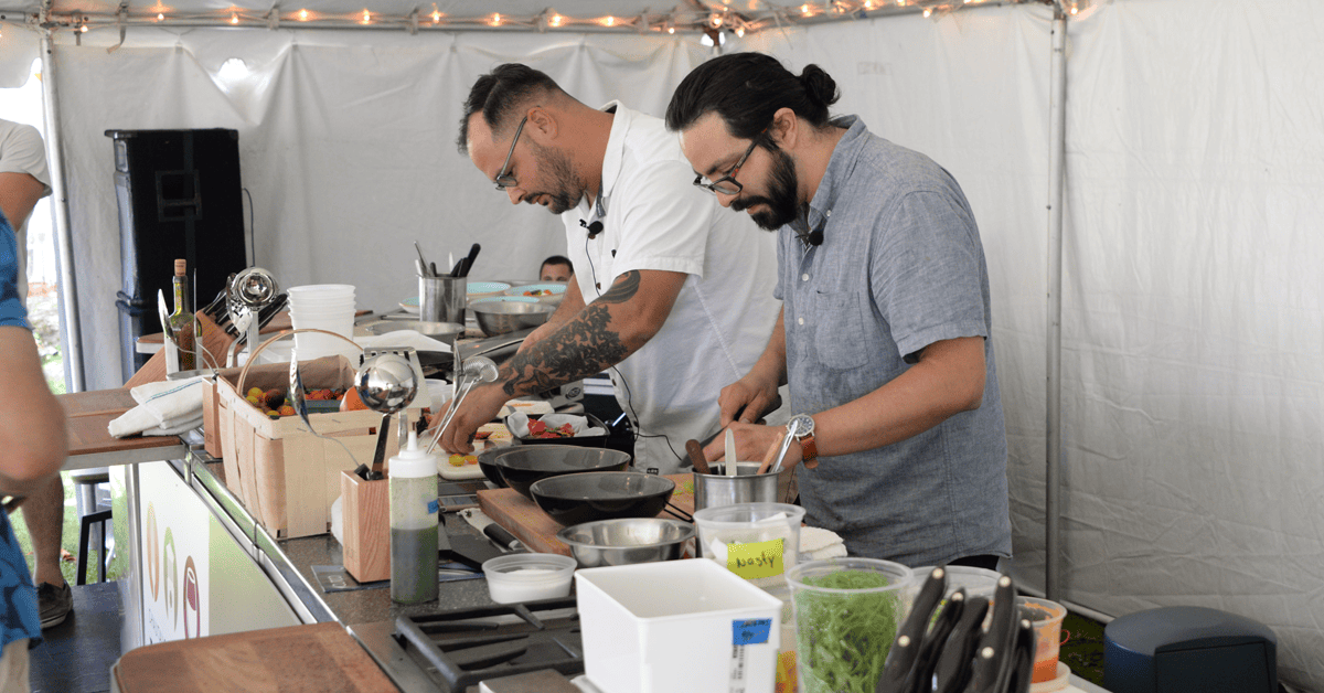Two men cooking