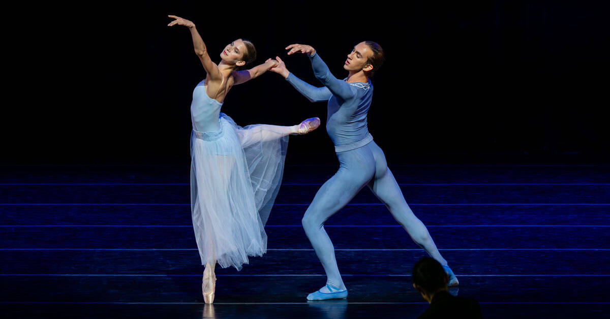 A male and female dancer in blue